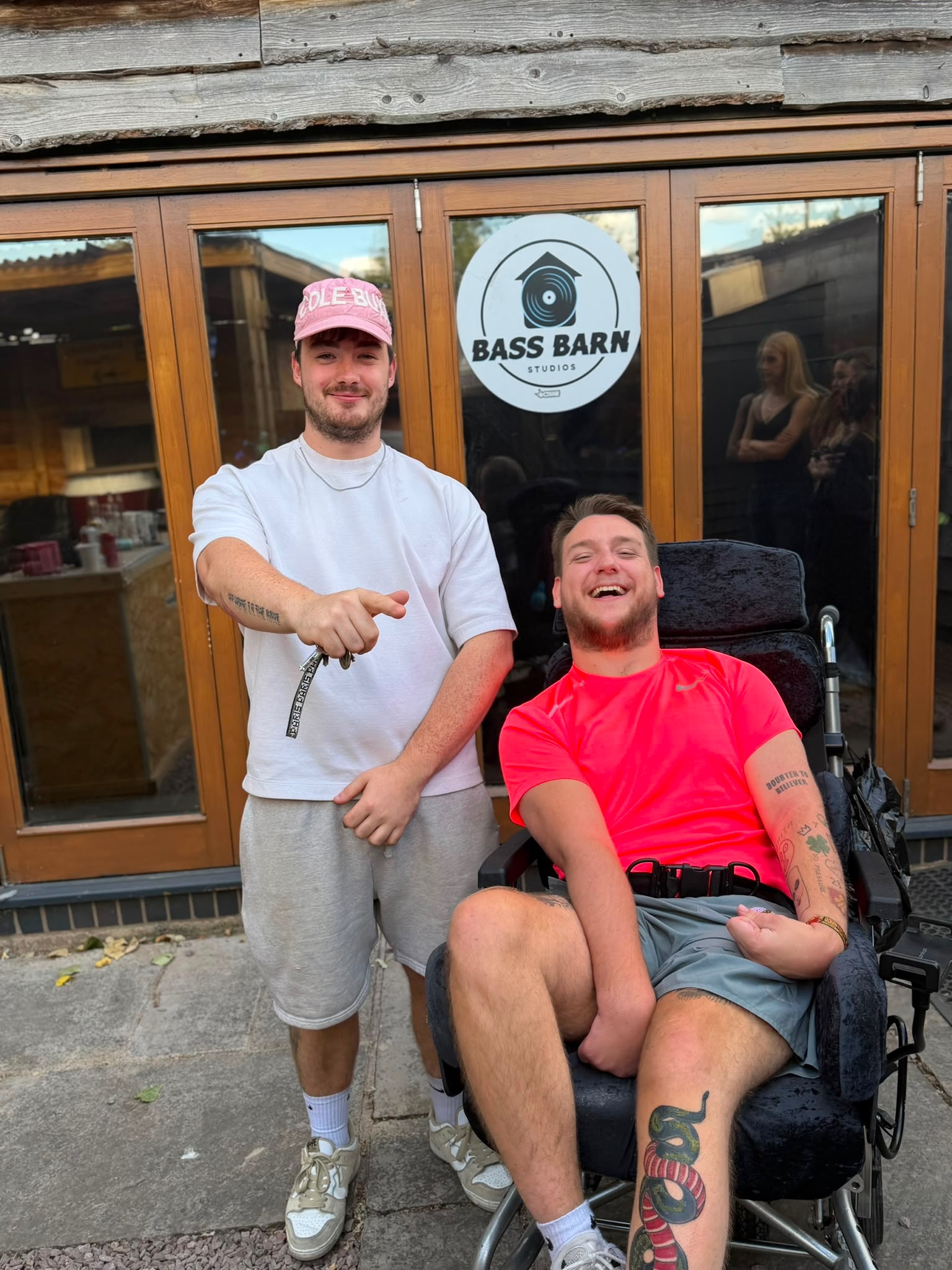 Two members of the J.O.K.E.R crew outside Bass Barn Studios during the takeover
